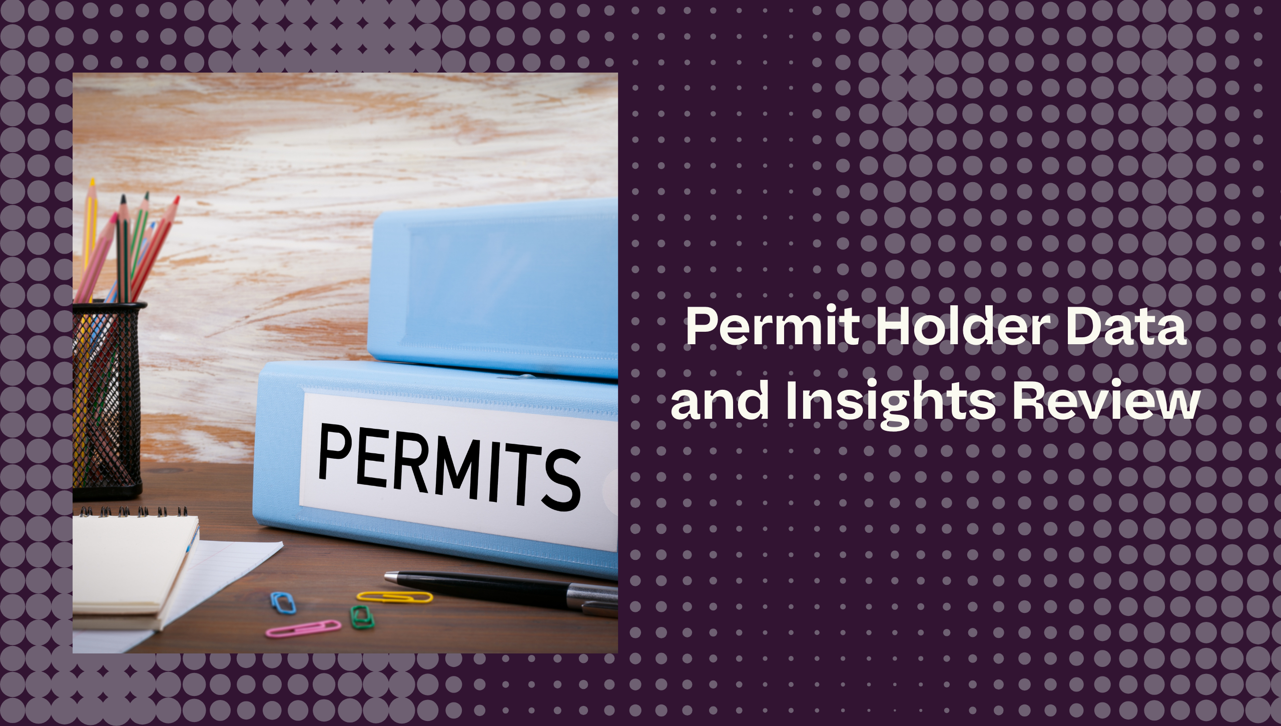 a binder labeled permits with office supplies on a desk